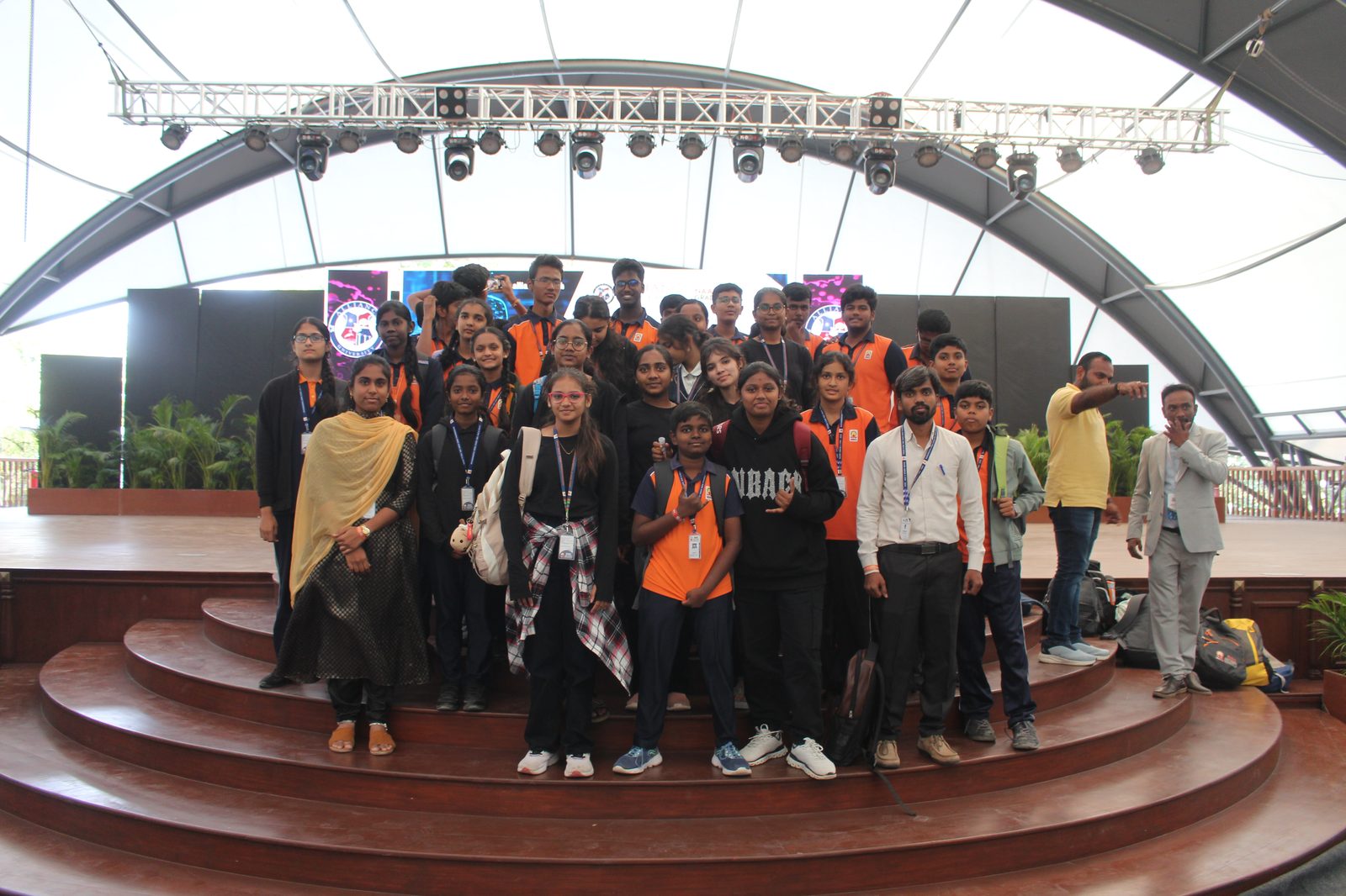MMS students and staff group photo on stage at Alliance NOVA Fest