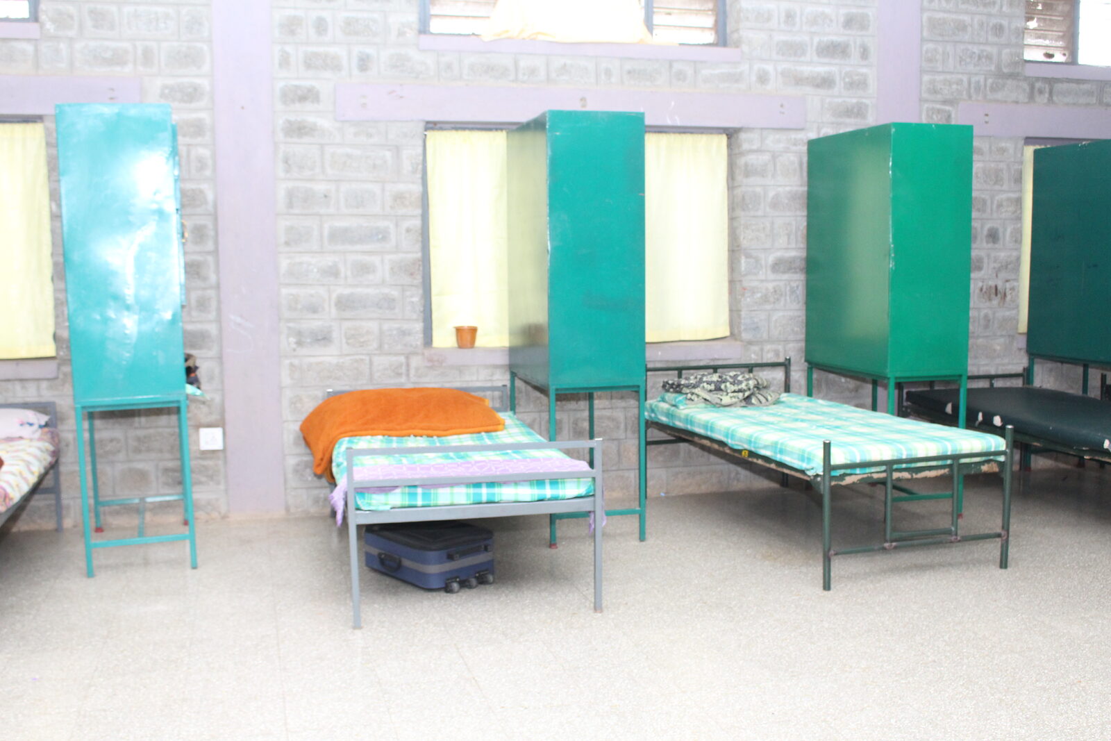 Hostel dormitory beds and personal cupboards