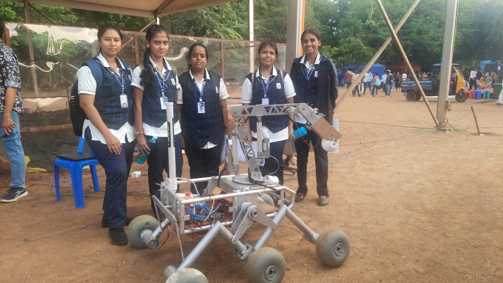 MMS students with a rover robot exhibit at the Open House