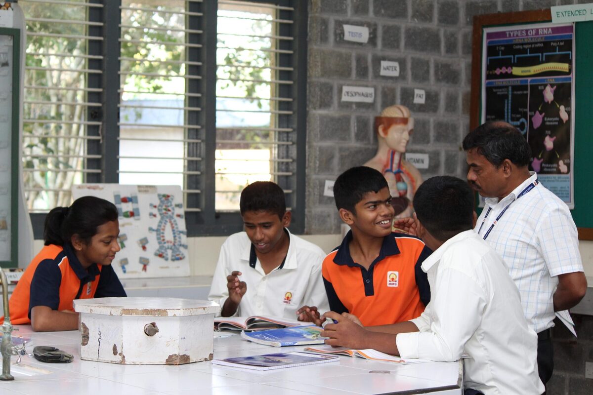 Students discussing their findings during a shared biology exercise