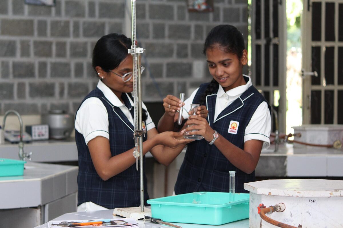 Students recording the end-point of a titration