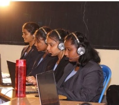 Students using headsets and laptops for language lab practice sessions