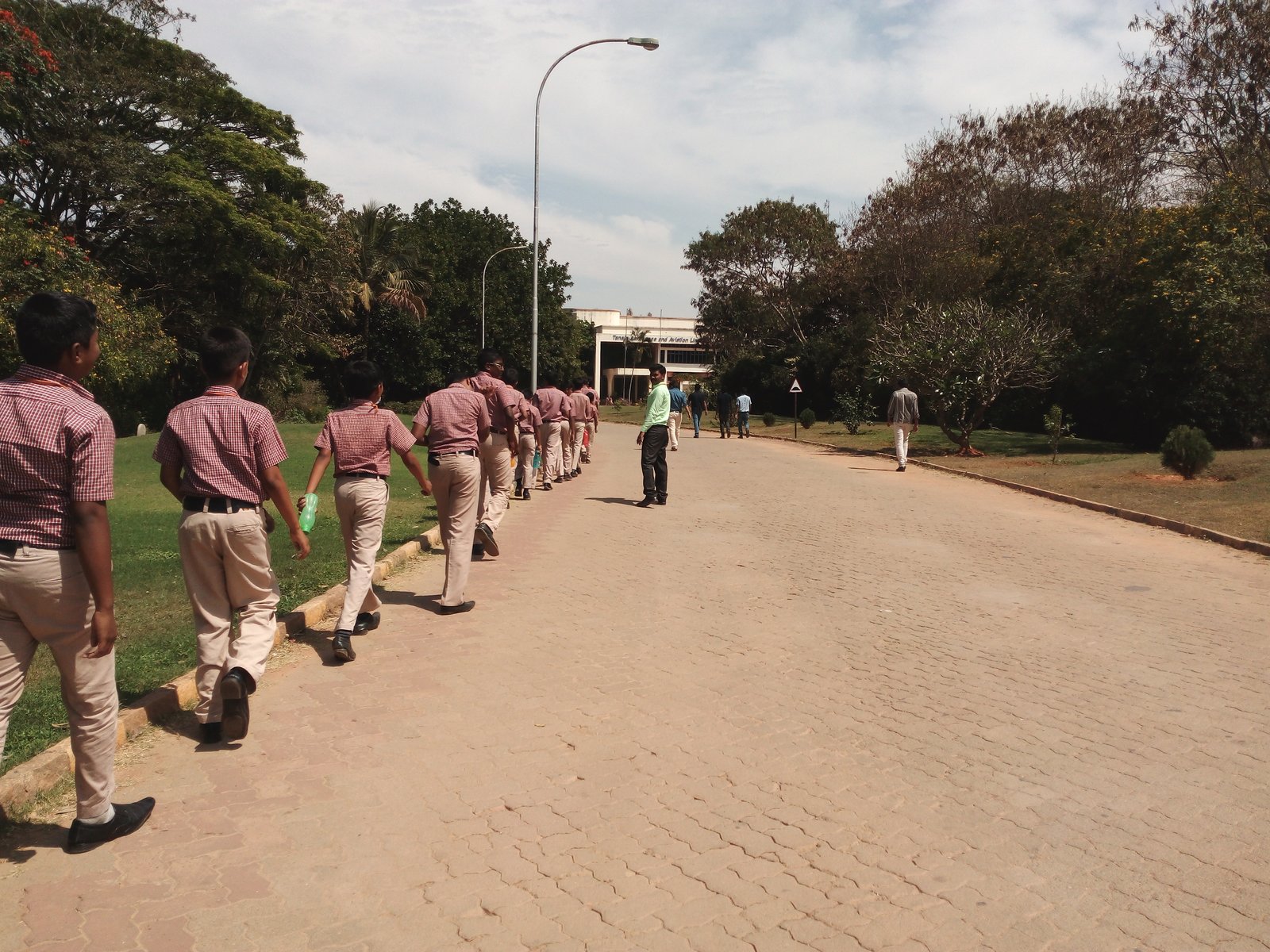 MMS students walking towards the Taneja Aerospace and Aviation Limited (TALL) building, Hosur Airdrome