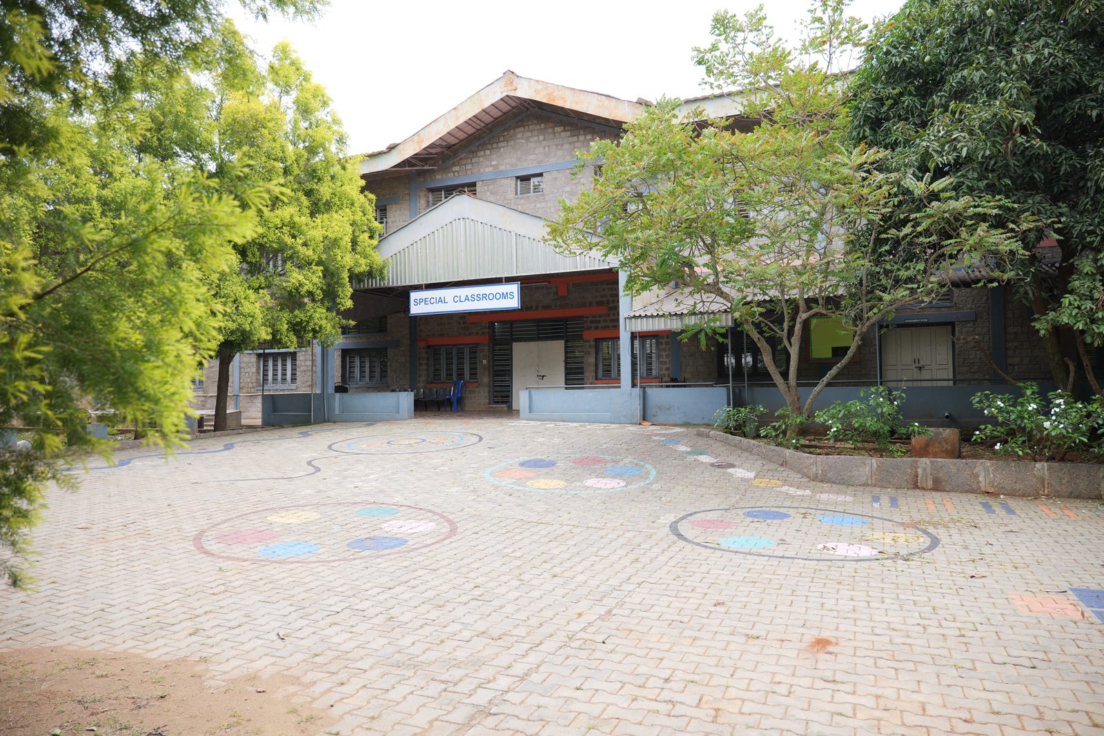 The entrance to the Special Classrooms building on the MMS campus, with a signboard above the door