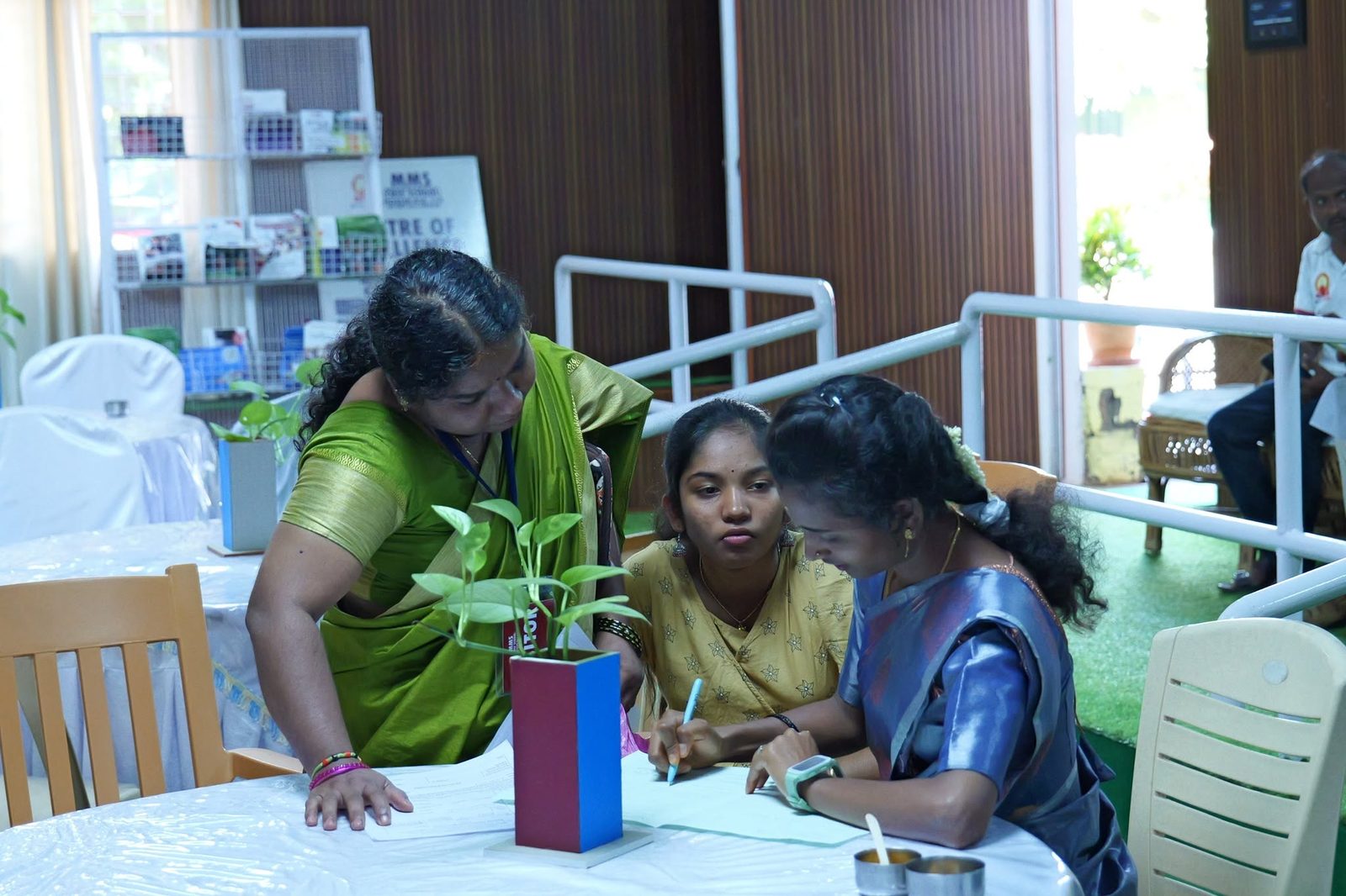 Parents fill in the admission form with help from MMS staff