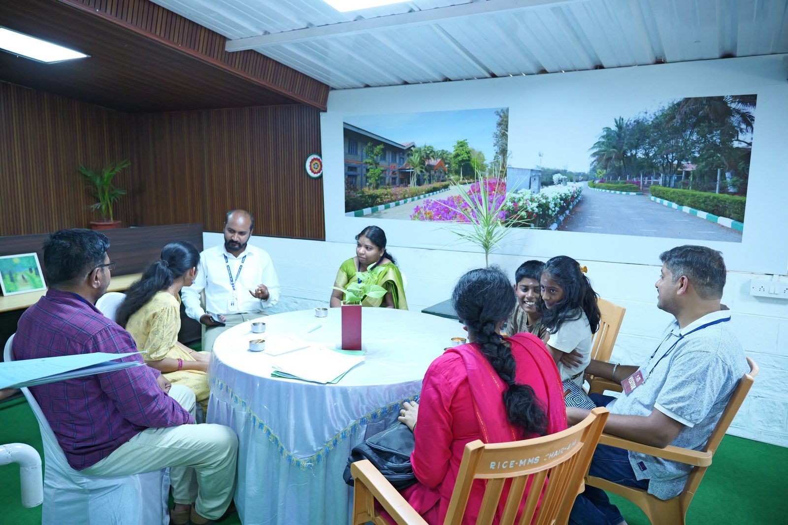 Parents talk with MMS staff at a round table in the school office